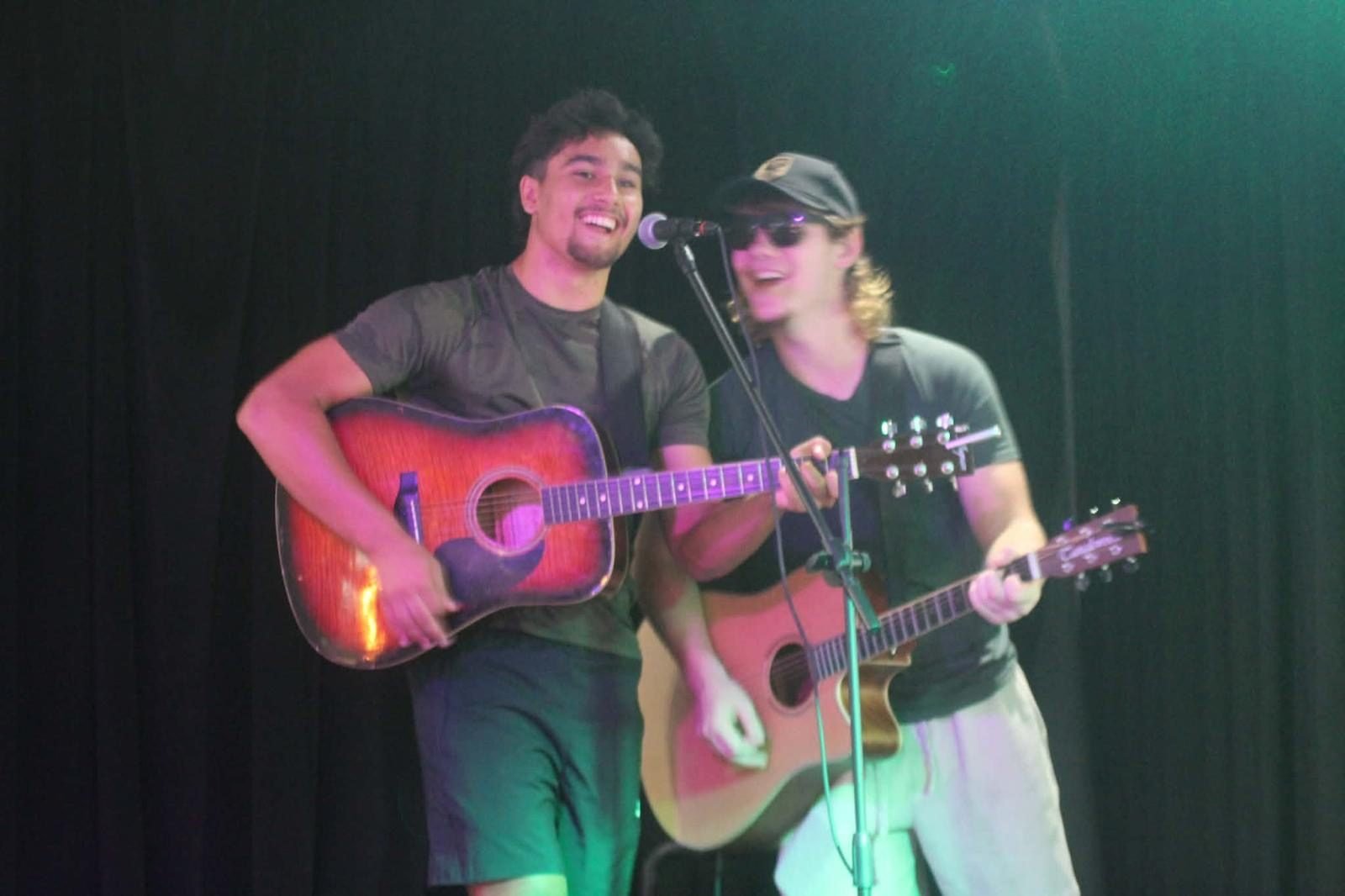 Sharing the mic and a laugh on stage