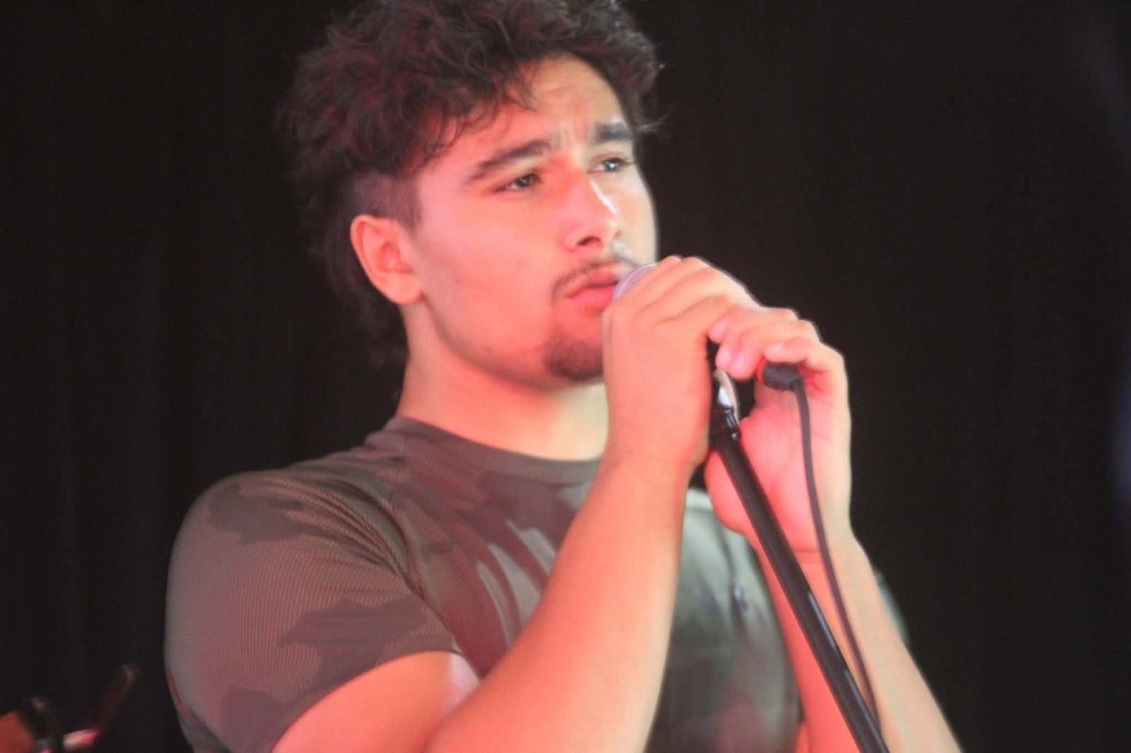 Hands on the mic, lost in the song